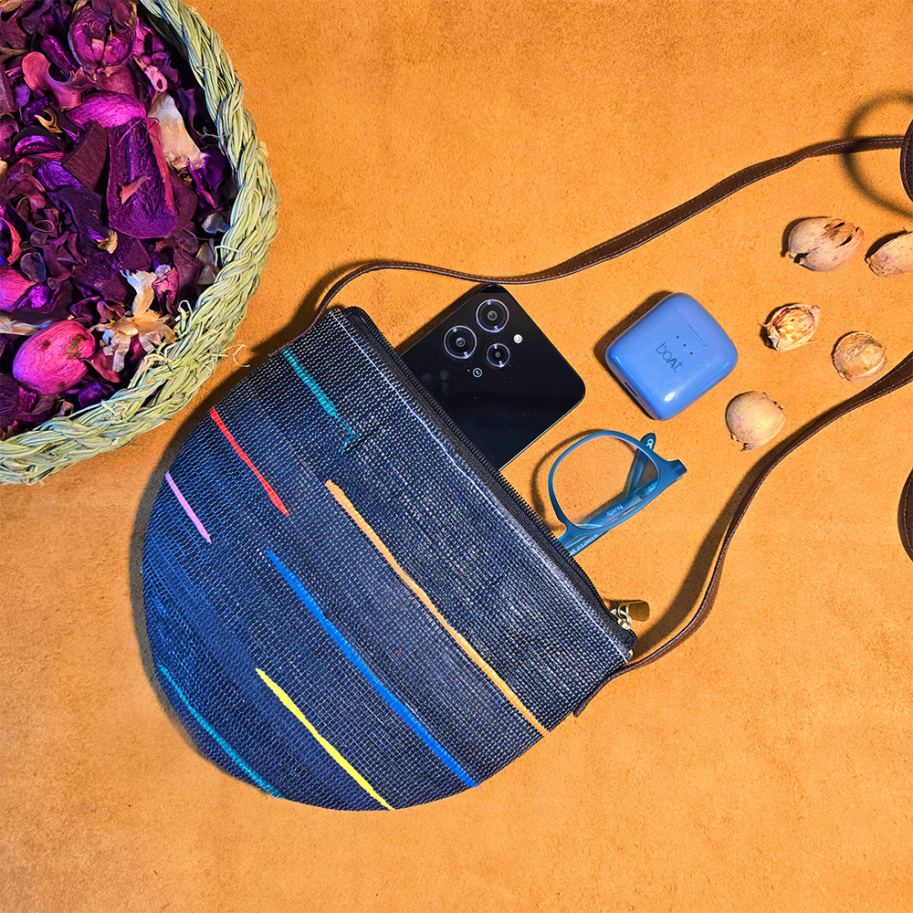Rajiben- Denim Blue Upcycled Plastic Handwoven Half moon Sling Bag