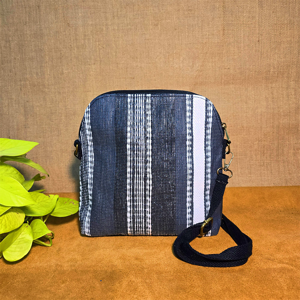 Rajiben- Black & White Stripe Upcycled Plastic Handwoven curved rectangular Sling Bag - Image 2