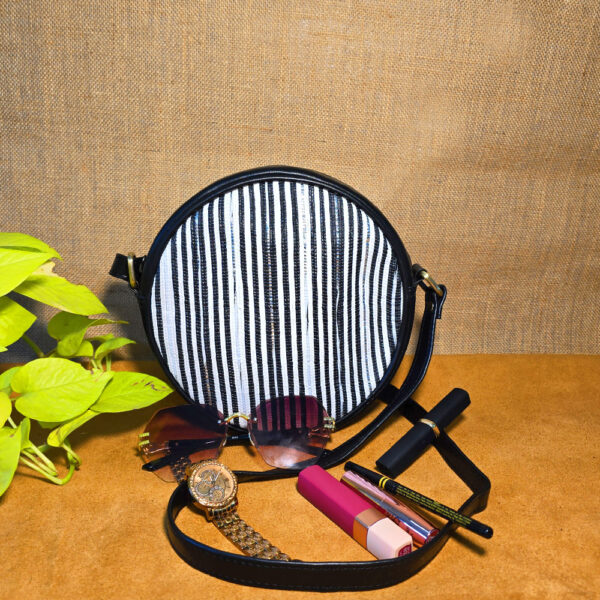 Rajiben- Black & white strip Upcycled Plastic Handwoven circular Sling Bag